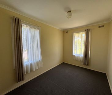 Neat Three-Bedroom Home in Prime Location - Photo 3