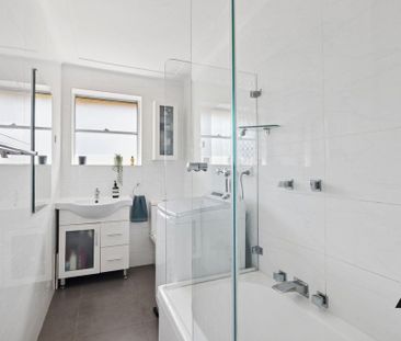 Leafy Top-Floor Haven with Dual Balconies and Modern Comfort - Photo 2