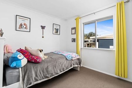 Family home with multiple living zones and large fenced yard - Photo 4