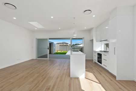 Modern 3-Bedroom Duplex Offering Style and Low-Maintenance Living! - Photo 4