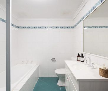 Charming Brick Apartment with Scenic Balconies - Photo 5