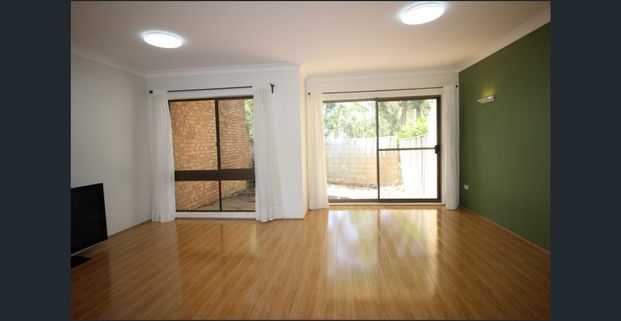 Convenient Townhouse in a Prime Location - Photo 1