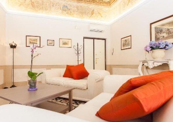 Center-Historic Jewish Quarter: Elegant apartment situated in beautiful Palazzo Nobiliare. Entrance, spacious living with original wood frescoed ceilings, large modern dining and kitchen, 4 bedrooms, 4 Baths, small terrace. #1527