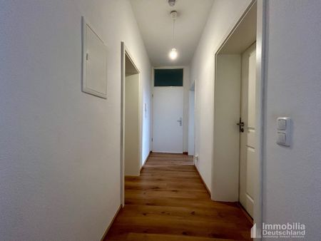 Moderne 3-Zimmer Erdgeschosswohnung mit Garten - Foto 3