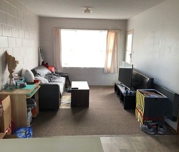 Tidy and spacious, this one-bedroom upstairs flat sits in a quiet b... - Photo 1