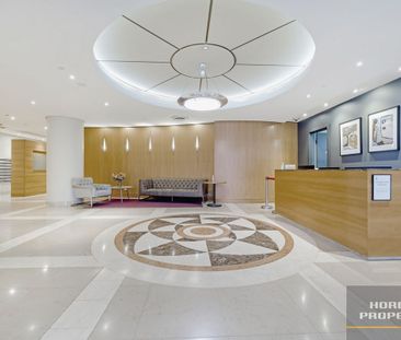 Freshly Renovated Two-Bedroom Apartment with City Views - Photo 5