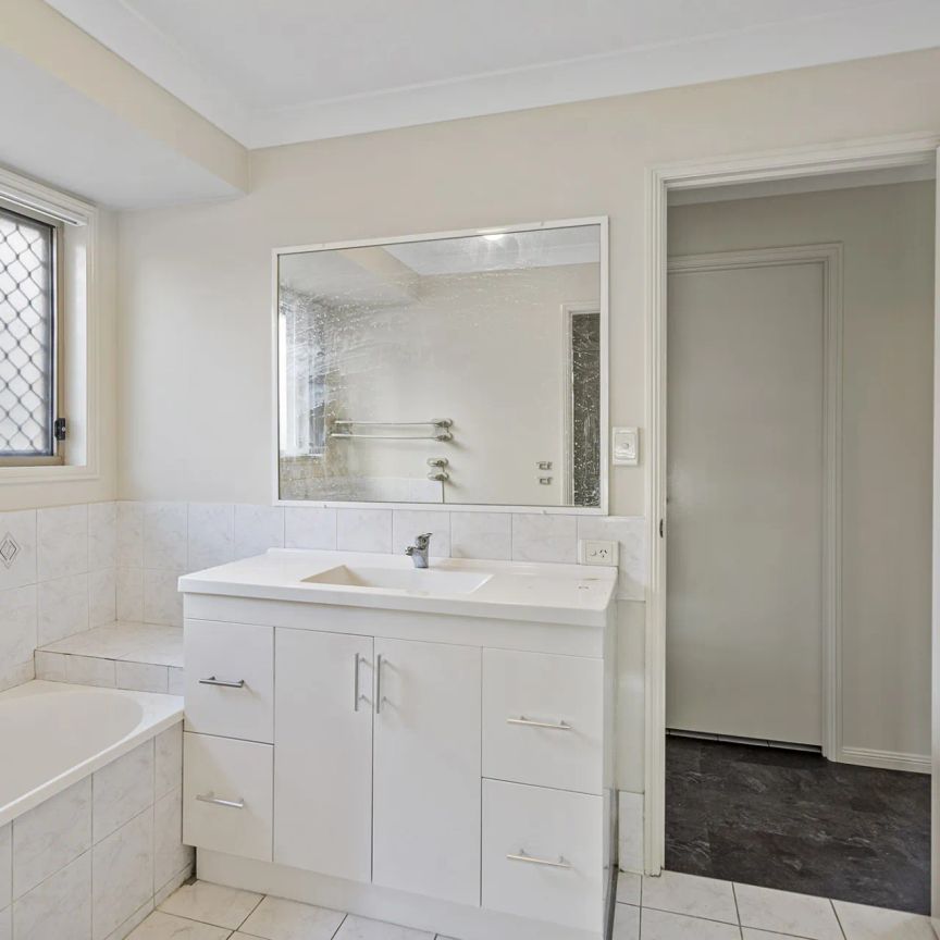 Four bedroom home with air conditioning on large block.. - Photo 1