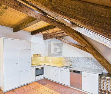 WITH VISIBLE BEAMS AND TILE STOVES! - Photo 3