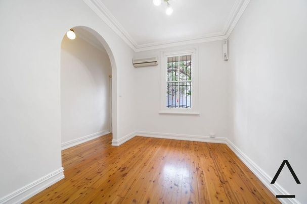 Two-Storey Terrace in Tree-lined Street - Photo 1