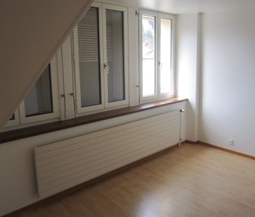 Appartement de 4 pièces au 3ème étage situé au centre du village - Photo 3