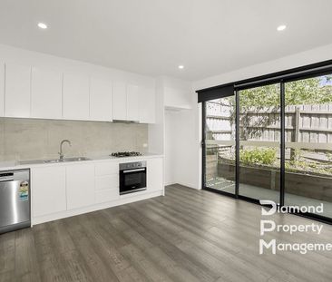 Luxurious Townhouse Living with Cutting-Edge Features - Photo 1