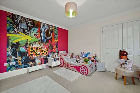 Set within a prestigious private estate, this impressive six bedroom residence offers generous and versatile accommodation perfectly designed for modern family living. - Photo 4