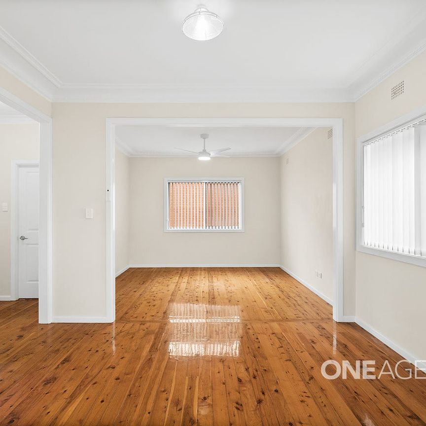 WELL-PRESENTED HOME WITH VERSATILE STUDIO AND BEAUTIFUL TIMBER FLOORS - Photo 1