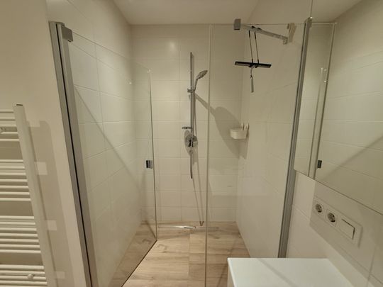 Ideale 2-Zimmer Gartenwohnung mit Tiefgarage und Parkplatz - Foto 1