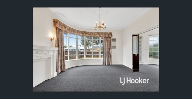 UPDATED 3 BR HOME WITH HUGE RUMPUS ROOM, & HEAT & COOL! - Photo 1