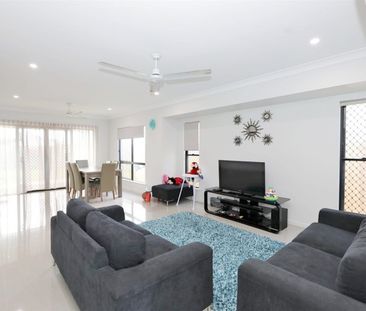 Modern Four-Bedroom Family Home in Prime Location - Photo 1