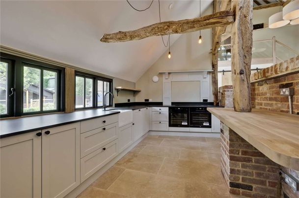 An exceptional barn conversion, combining character and contemporary design in the village of Churt. - Photo 1