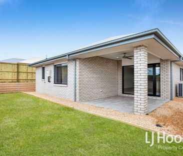STUNNING FAMILY HOME IN FLAGSTONE WITH DUCTED AIR + QUALITY FINISHES! - Photo 1