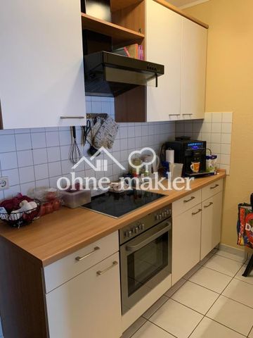 Frisch renovierte 2-Zimmer-DG-Wohnung mit neuer EBK, Balkon & Stellplatz in zentraler Lage von Weyhe - Photo 3