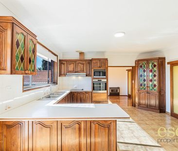 Charming Four-Bedroom Home with Garage and Convenient Location - Photo 3