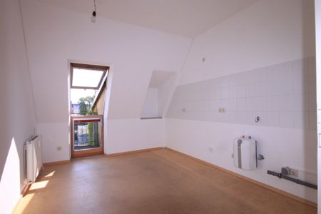 Tolle Dachgeschosswohnung mit großem Balkon - Foto 4