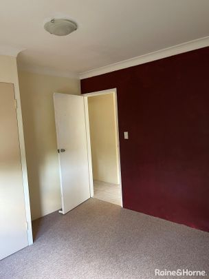 Well-Maintained Top Floor Apartment in Quiet, Convenient Location - Photo 1