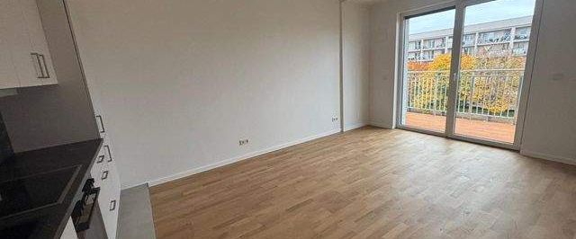 Wohnung mit EB- Küche - Erstbezug, Balkon u. Fußbodenheizung - Foto 1