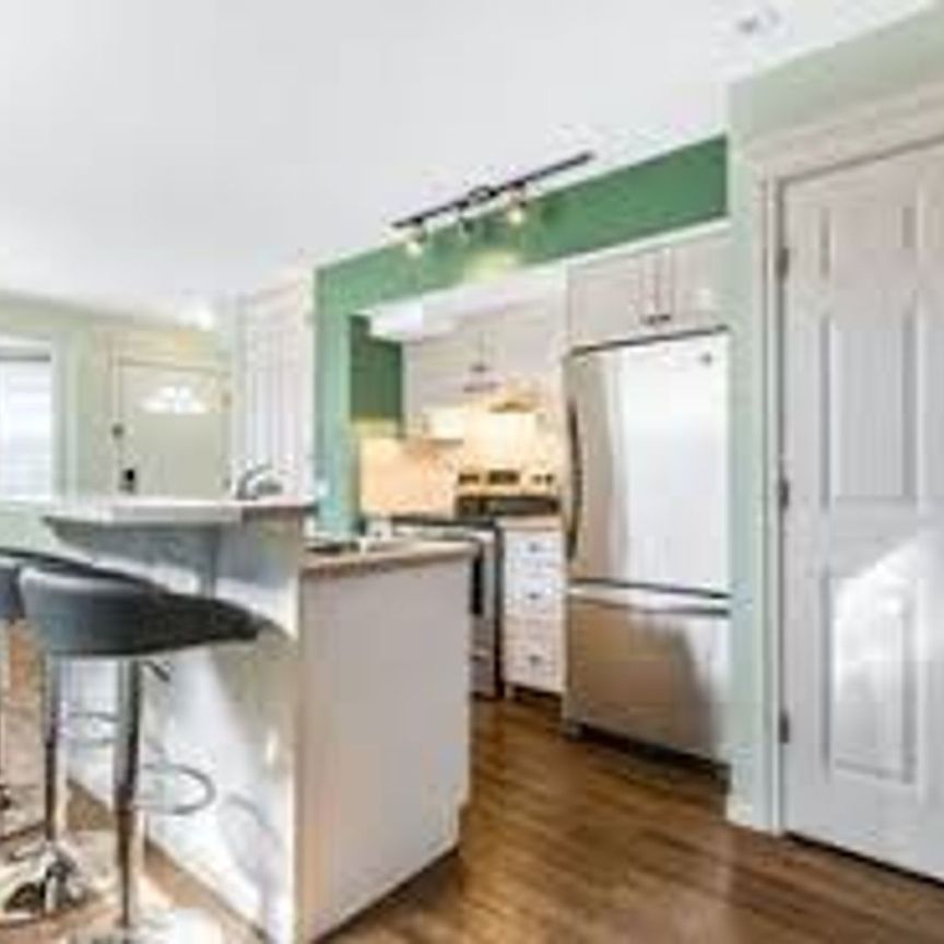 Move-In Ready 2-Bedroom Townhouse in the Heart of Downtown Okotoks - Photo 1