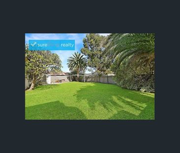 ENJOY THE TRANQUILITY OF THIS JUMBO SIZE GARDEN UNIT - Photo 2