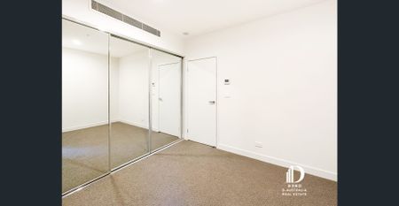 Sophisticated 3-Bedroom Apartment with 2 Study Nooks + Powder Room - Photo 3