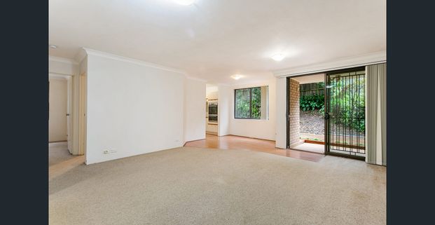 FANTASTIC TWO BEDROOM APARTMENT WITH COURTYARD - Photo 1