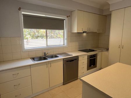 NEAT AND TIDY THREE BEDROOM HOME - Photo 4