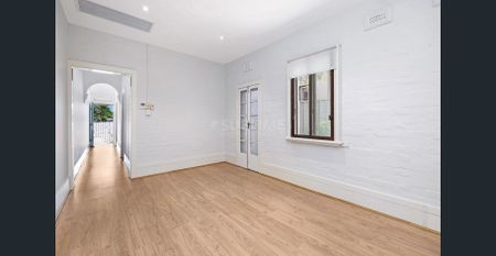 Stunning Renovated 2 Bedroom Home + Spacious Attic in Premier Location - Photo 3