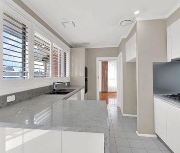 Spacious Three Bedroom Brick Home with Multiple Living Areas and Am... - Photo 3