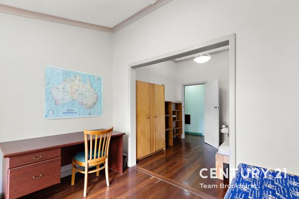 Charming 1950s Home with Modern Flexibility & Pristine Gardens! - Photo 1