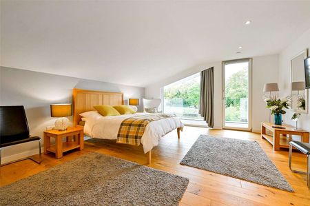 Situated by the water's edge this modern and detached family home boasts exceptional energy efficiency and views of Old Windsor Lock. - Photo 4