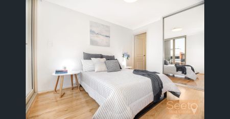 This full-brick, north facing, split-level apartment has timber-style flooring so it's ready to move in and enjoy. - Photo 5