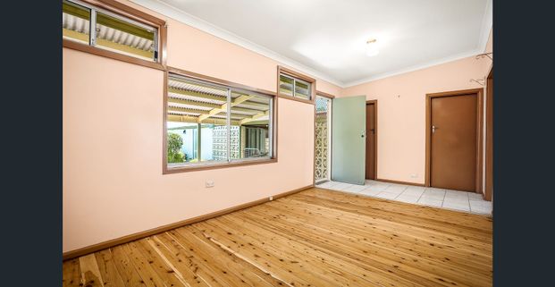 Air-Conditioned Four-Bedroom Family Home with Two Living Areas, Single Carport and Tandem Garage! - Photo 1