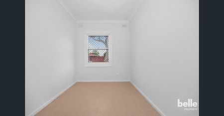 Comfortable 3-Bedroom Home with Spacious Yard in a Convenient Location - Photo 3