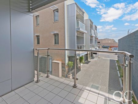 Open the Door to City Serenity with a Private Balcony - Photo 4