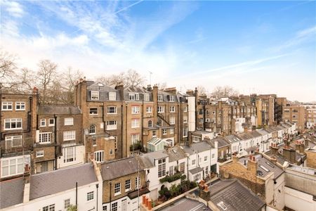 A spacious three double bedroom flat set over two floors with high spec finish, wood flooring and contemporary kitchen and bathrooms. - Photo 4