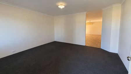 Neat 4-Bedroom Home with Monthly Lawn Mowing Included - Photo 2