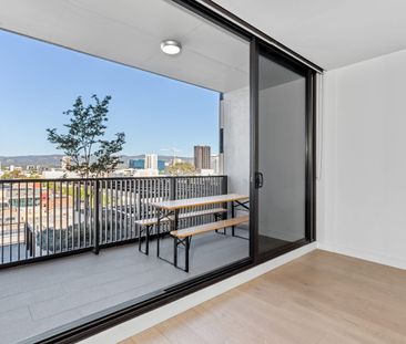 An elevated escape with light, lifestyle & views - Photo 3