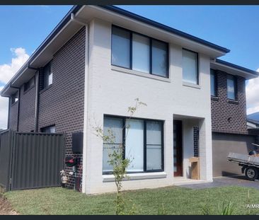 Modern Family Home in Jordan Springs East | 4 Bedrooms + Study + Do... - Photo 2