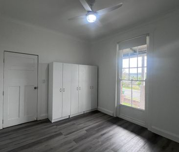 Spacious 3-Bedroom Home with Sunroom and Garden Shed - Photo 2