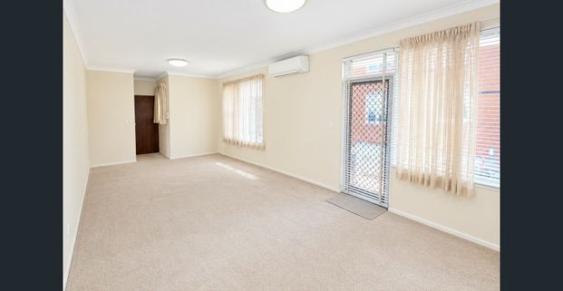 FRESHLY PAINTED TWO-BEDROOM APARTMENT WITH DOUBLE PARKING - Photo 1