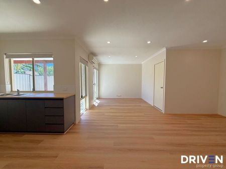 Freshly Renovated Home with Modern Comforts in the Heart of Queens Park - Photo 2