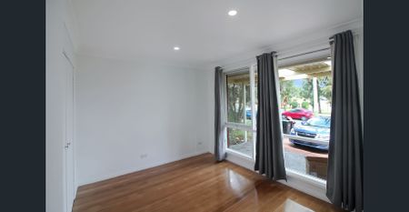 Charming Three-Bedroom Home with Spacious Yard - Photo 2