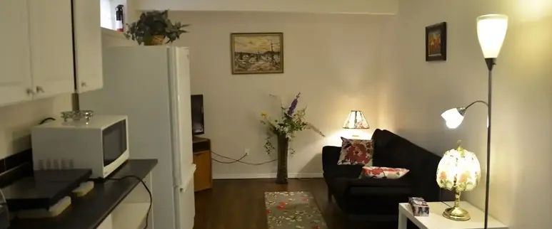 VERY COZY ONE BEDROOM AND A DEN BASEMENT SUITE IN TARADALE NE | Calgary - Photo 1