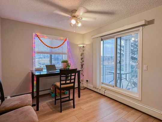 Spacious 2 Bed, 2.5 Bath Condo In Shawnessy | Fireplace, Balcony & Rent Incentive - Photo 1